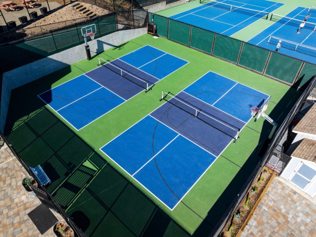 Multi-use pickleball and basketball court at Strawberry Recreation Center in Mill Valley. The court was reconstructed using the slipsheet method and surfaced with Plexipave acrylic resurfacer in Dark Blue and Medium Green.