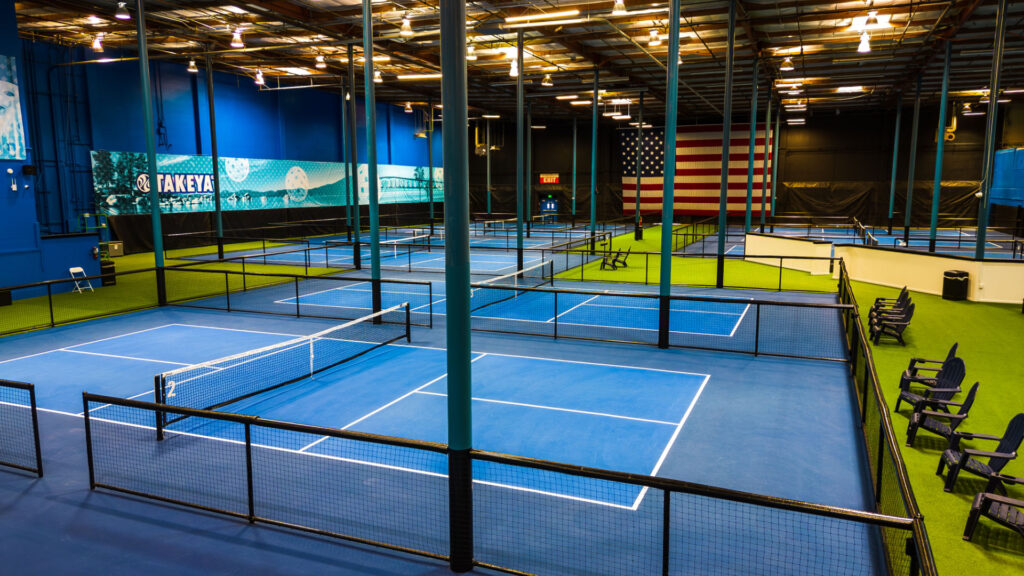 20 pickleball courts at The HUB Silicon Valley that Vintage Contractors constructed using Acrytech Competition Blue and Light Blue acrylic paint. All Black divider fencing was installed by Vintage Contractors.